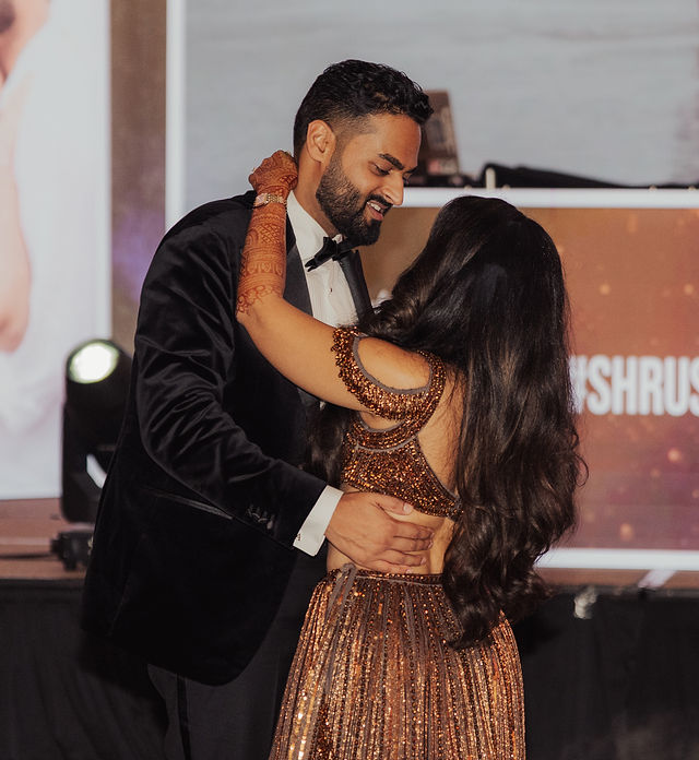 The couple sharing a dance at the reception