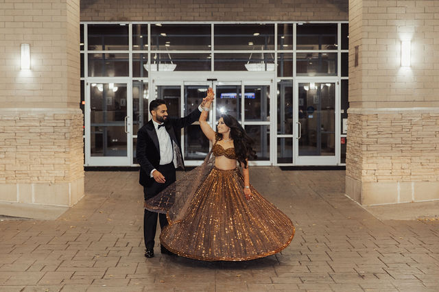 Shrusti and Rishi outside their reception venue