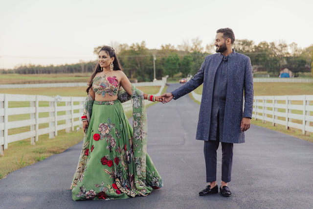 Shrusti and Rishi hand in hand at dusk