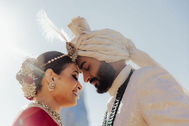 Shrusti and Rishi leaning together before the ceremony