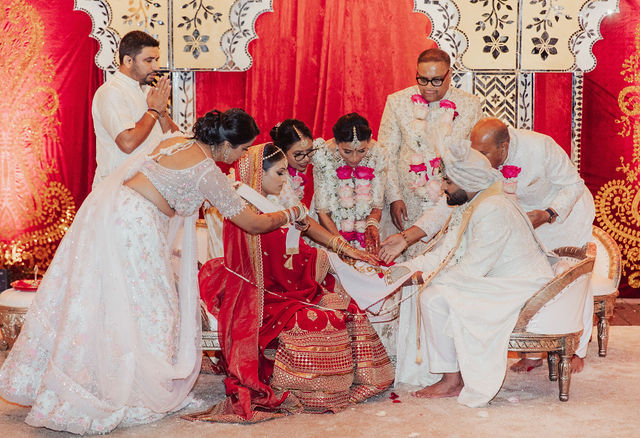 Shrusti and Rishi taking part in the wedding rituals
