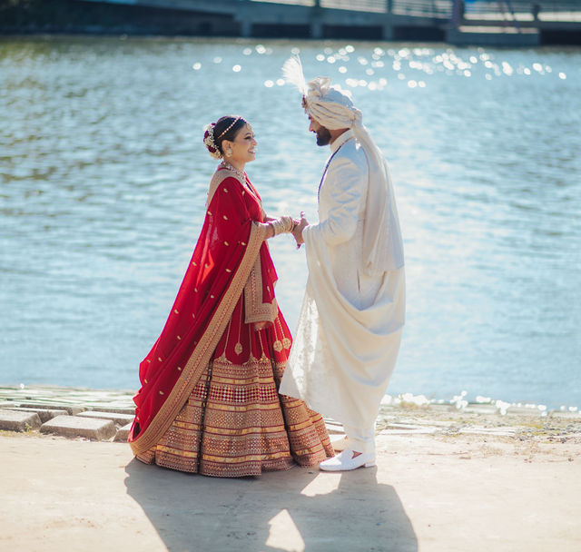 Shrusti and Rishi together by the water after the wedding