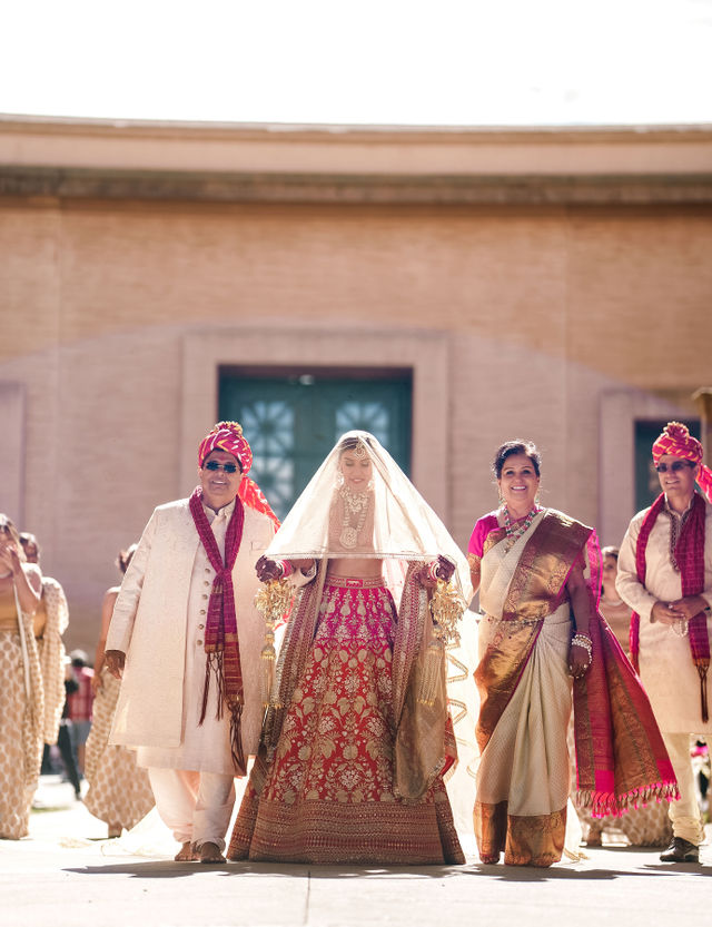 Vishalli walking toward the wedding ceremony with her family
