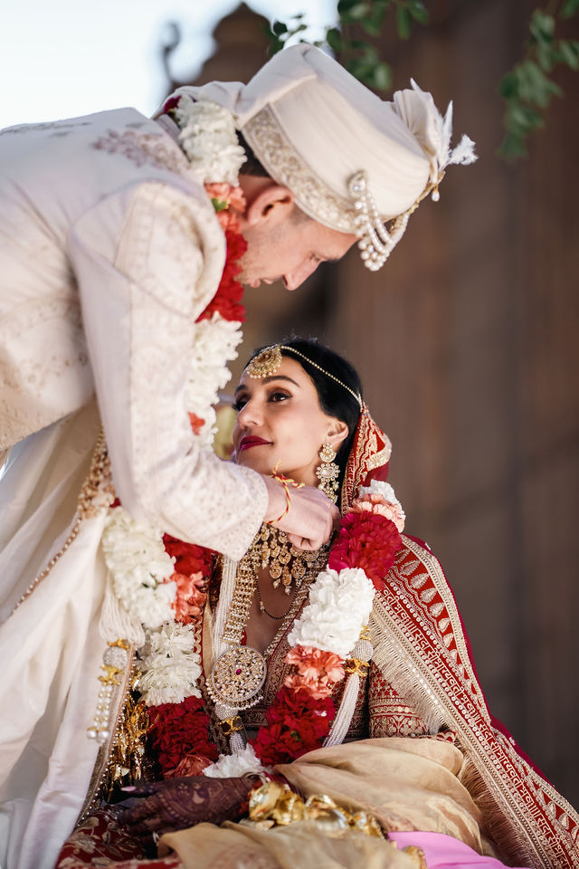 Lewis reaching toward Vishalli during the wedding ceremony