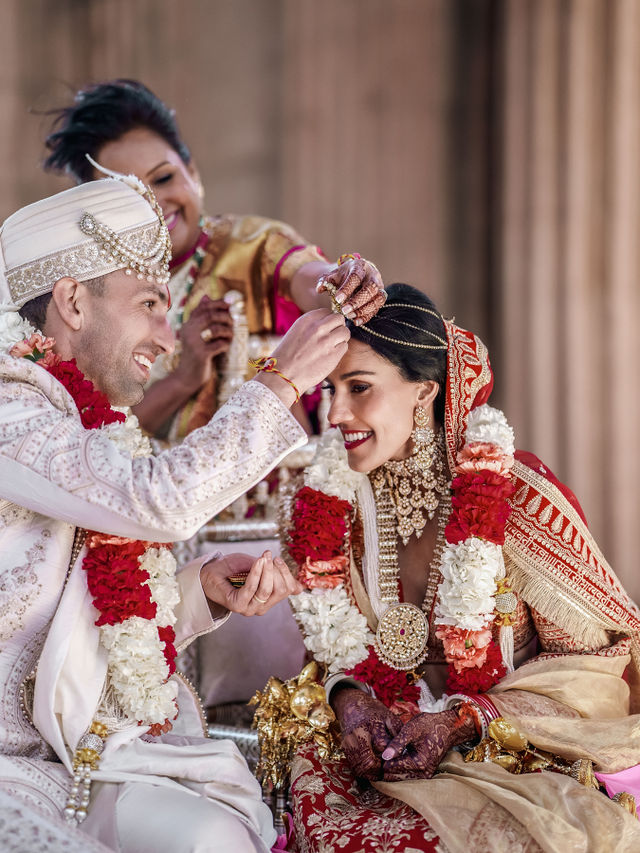 Vishalli and Lewis sharing a close wedding ritual