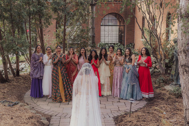 Nirali celebrates with her wedding party in the courtyard