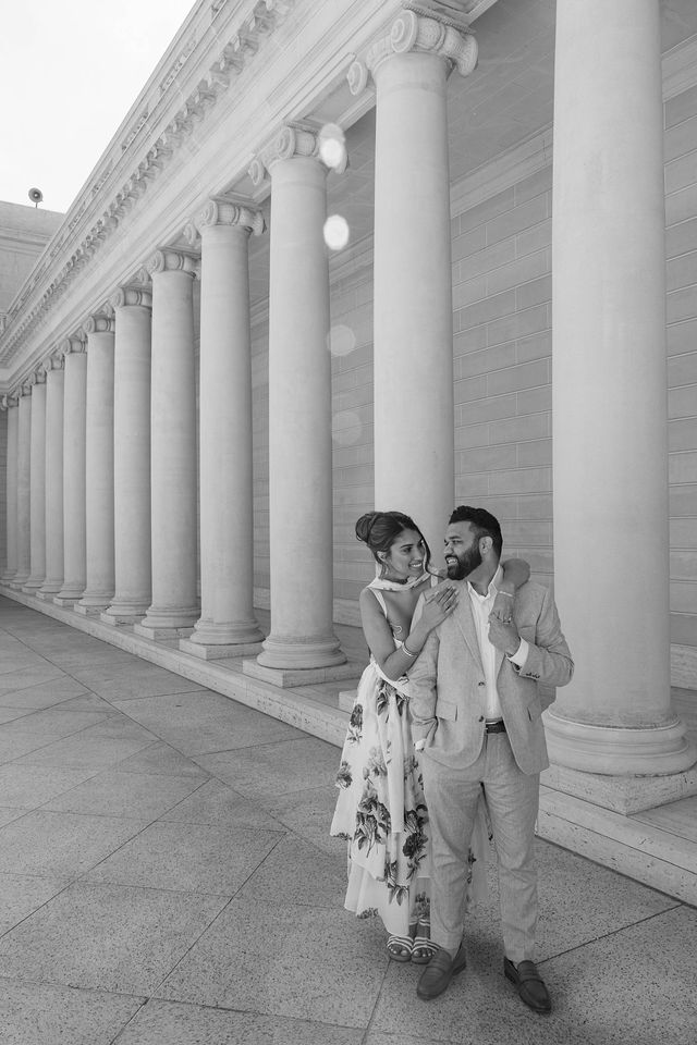 Yash and Parth walking through the long stone colonnade