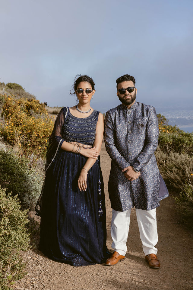 Yash and Parth posing together on the California coast