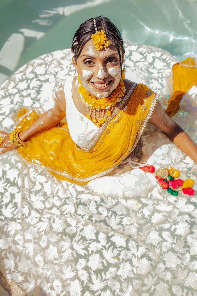 Zohal smiling in a yellow-and-white Haldi portrait