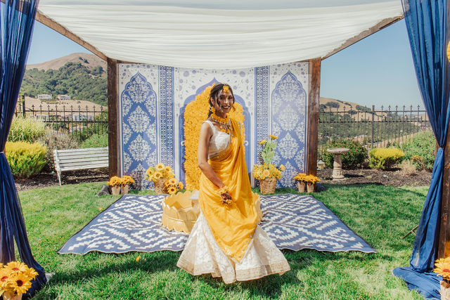 Zohal in yellow at her outdoor Haldi celebration