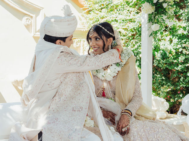 Zohal and Jairam taking part in a wedding ritual